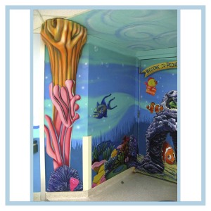 pediatric-entrance-murals-on-walls-healthcare-design-hospital-art-3d-fish-coral-columns-welcome-sign