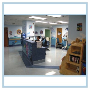 pediatric-unit-art-healthcare-design-murals-3d-fish-custom-bookcase-nurses-station