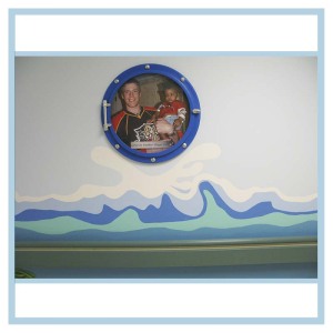 porthole-frame-wall-art-waves-in-hallway-healthcare-design-hospital-decorations