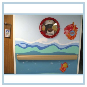 porthole-frame-with-childs-picture-room-number-hospital-art-healthcare-design-fish