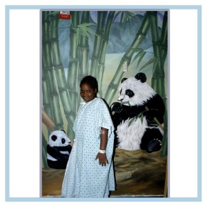 patient-enjoying-artwork-pandas-bamboo-rainforest-theme-hospital-art-healthcare-design